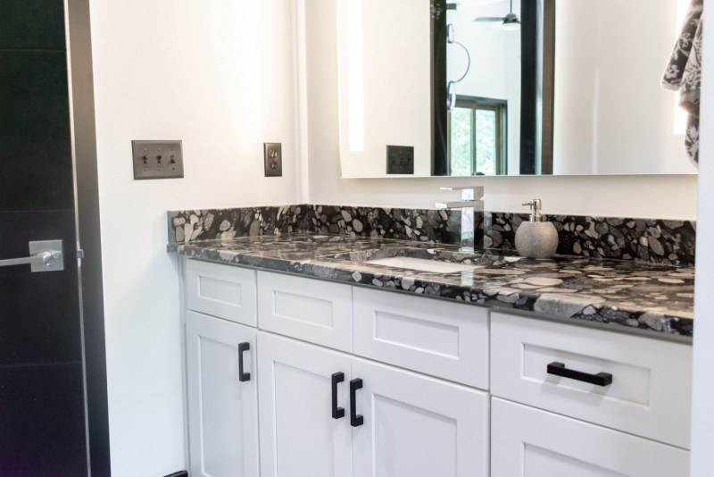 black-marinace-granite-vanity-white-cabinets-tub-surrounds-2-1-scaled-1.jpg